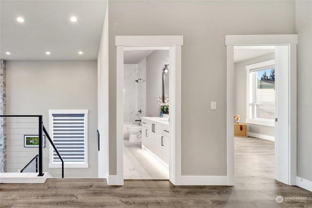 full bathroom with vanity, hardwood / wood-style flooring, shower / washtub combination, and toilet