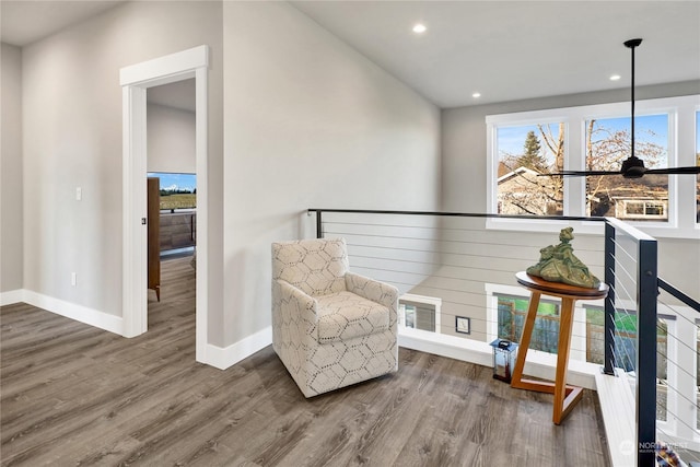 living area with hardwood / wood-style floors and a wealth of natural light