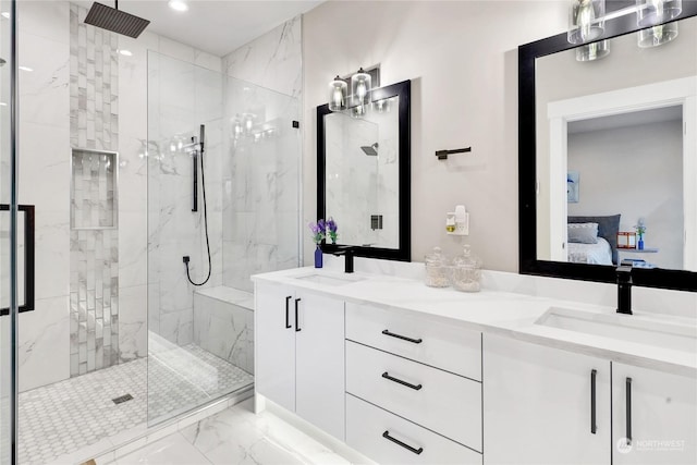 bathroom with vanity and a shower with shower door