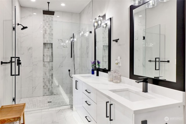 bathroom featuring vanity and a shower with shower door