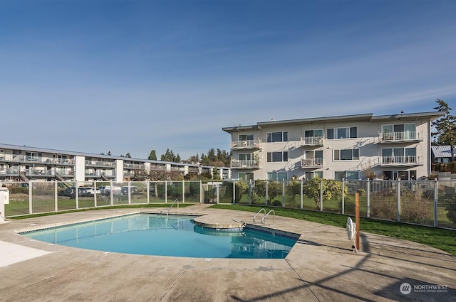 view of pool featuring a patio