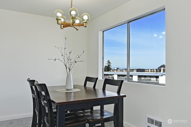 dining space featuring a chandelier