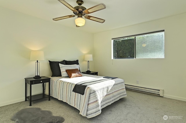 bedroom with ceiling fan, light colored carpet, and a baseboard heating unit