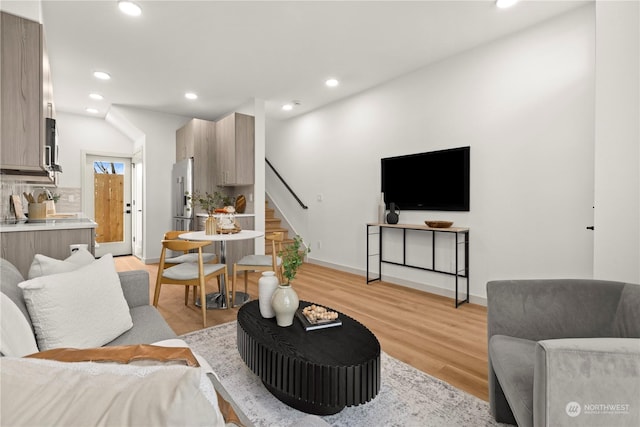 living room with light hardwood / wood-style flooring