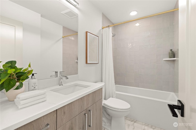 full bathroom featuring vanity, toilet, and shower / bathtub combination with curtain