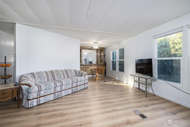 living room featuring ceiling fan and light wood-type flooring