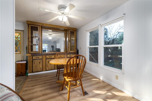 dining room featuring ceiling fan and light wood-type flooring