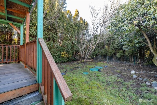 view of yard featuring a wooden deck