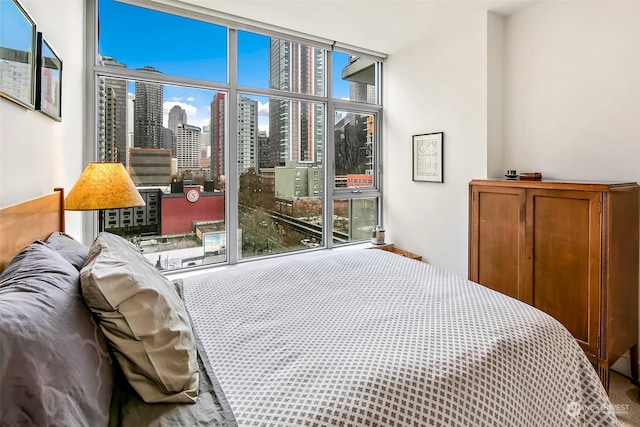 bedroom with multiple windows and carpet flooring