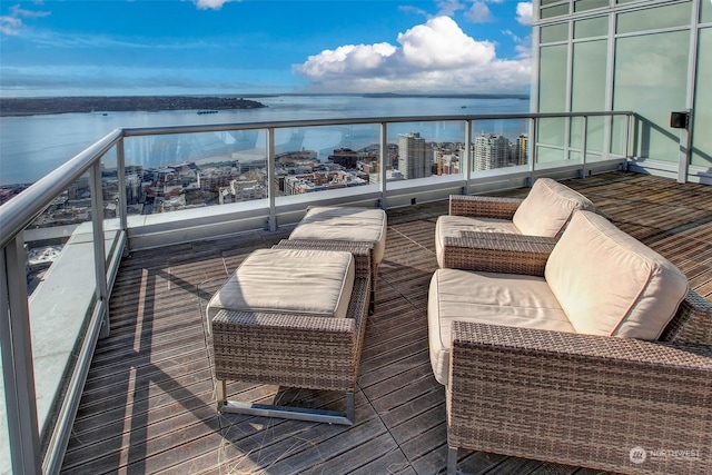 balcony featuring a water view