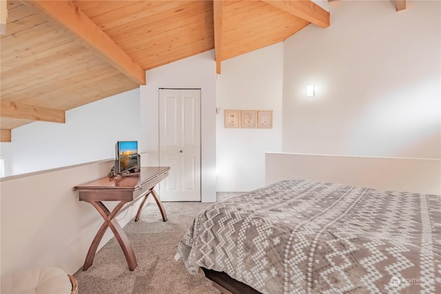 carpeted bedroom featuring lofted ceiling with beams, wood ceiling, and a closet