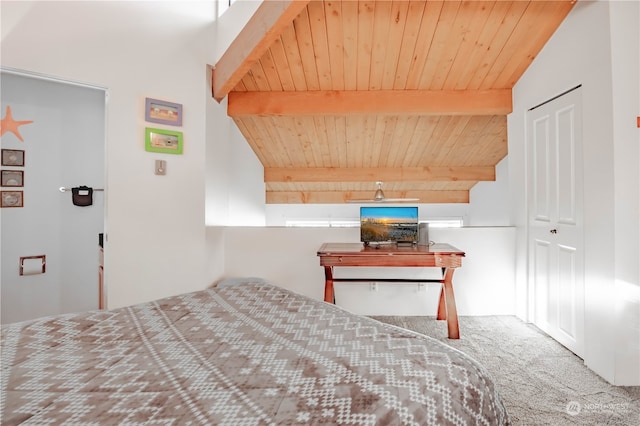 unfurnished bedroom with wood ceiling, beam ceiling, and carpet