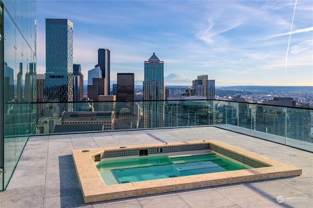 view of pool with a community hot tub