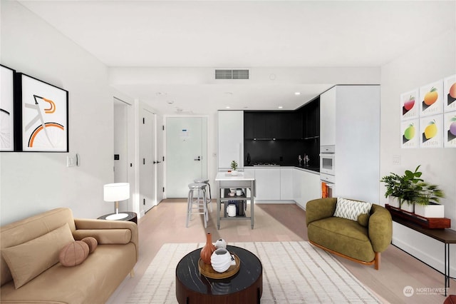 living room featuring light wood-type flooring