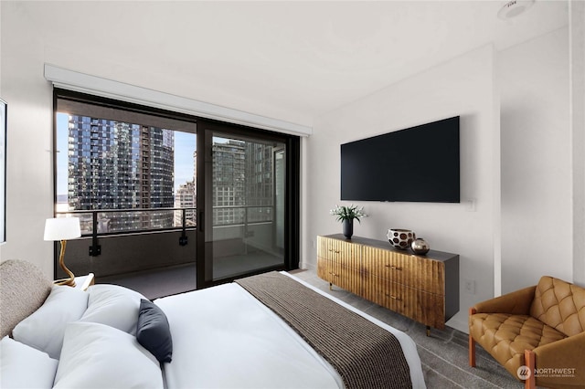 bedroom featuring carpet flooring and access to outside