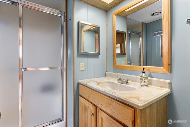 bathroom featuring vanity and walk in shower