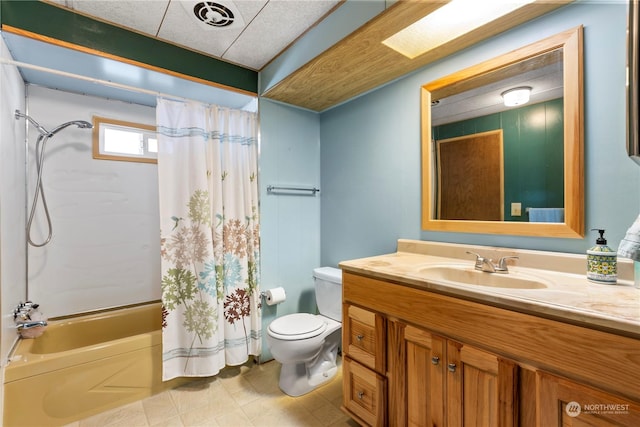 full bathroom with vanity, a skylight, toilet, and shower / bath combo