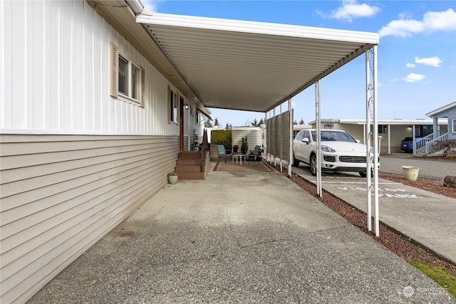 view of vehicle parking with a carport