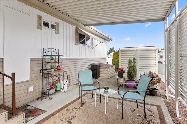 view of patio with a shed