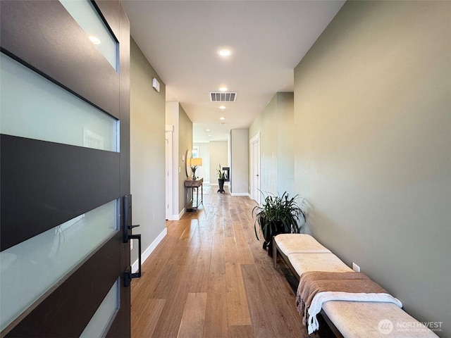 hallway featuring light hardwood / wood-style flooring