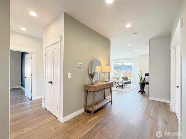 hall with light hardwood / wood-style flooring