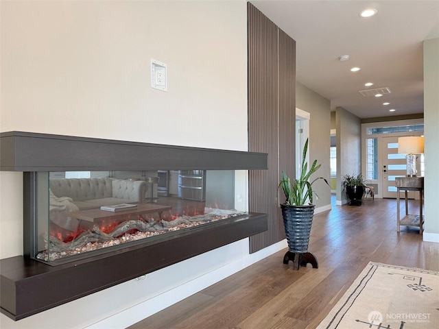 hallway featuring dark hardwood / wood-style flooring