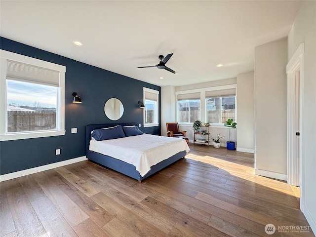 bedroom featuring ceiling fan and wood-type flooring