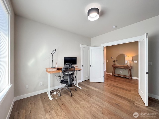 office with light hardwood / wood-style floors