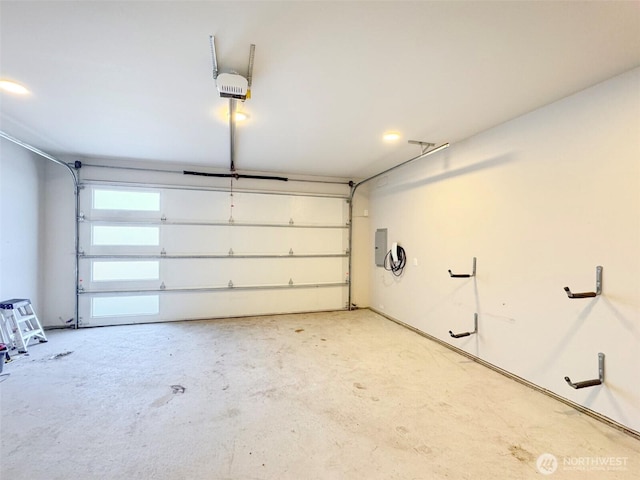garage featuring a garage door opener and electric panel