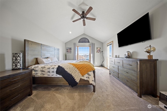 carpeted bedroom with vaulted ceiling and ceiling fan