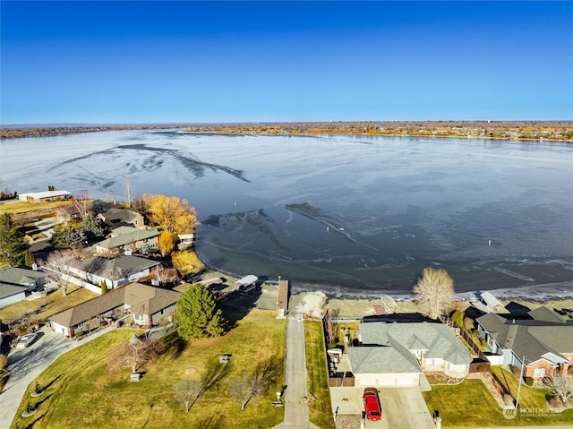 drone / aerial view featuring a water view