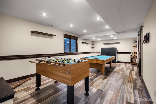 playroom featuring wood-type flooring, a wall mounted AC, and pool table