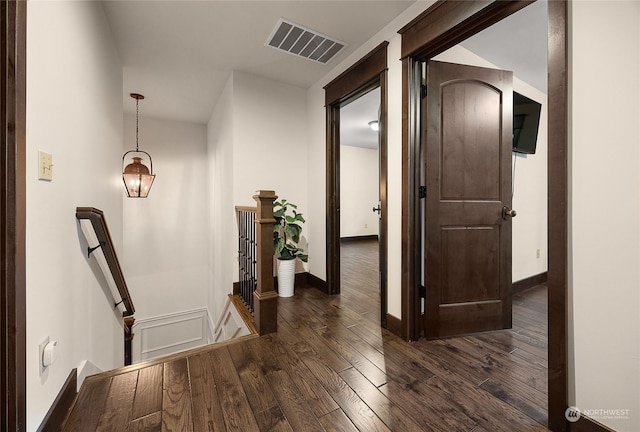 hallway with dark wood-type flooring