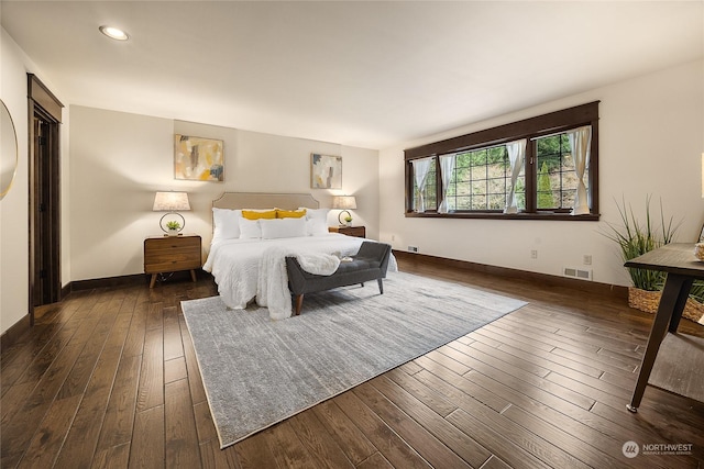 bedroom featuring dark hardwood / wood-style flooring