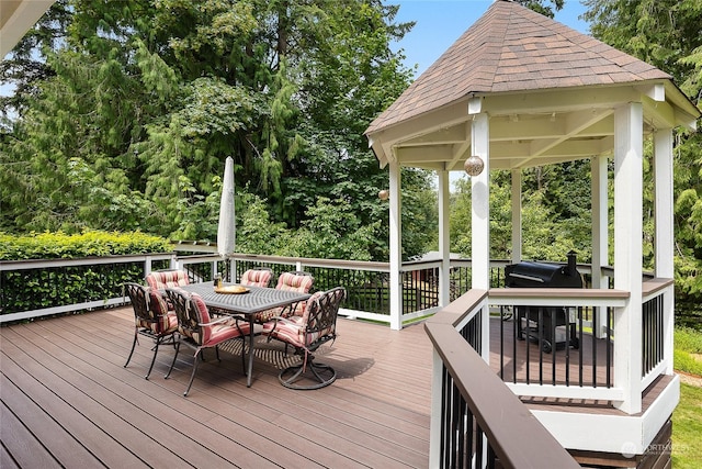 wooden terrace featuring a gazebo