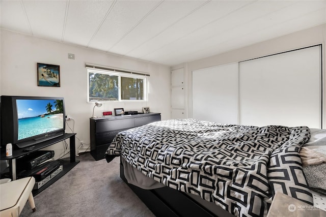 carpeted bedroom with a closet