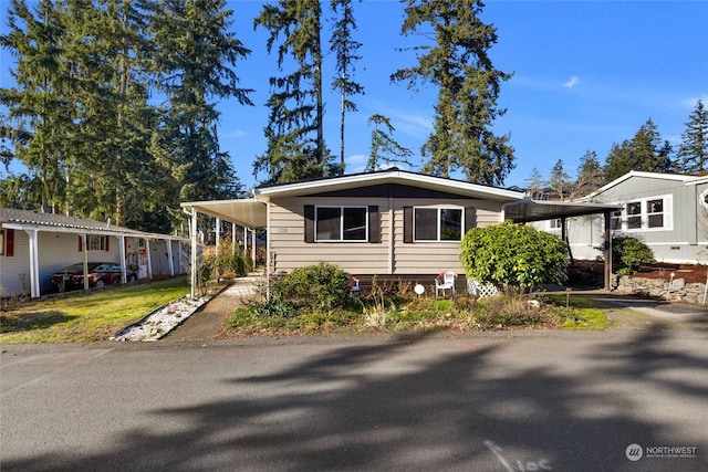 view of front of property with a carport