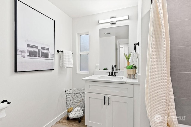 bathroom with vanity, hardwood / wood-style floors, and a shower with curtain