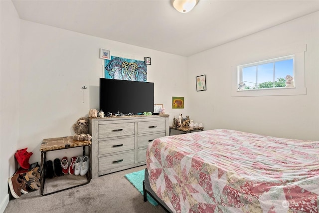 bedroom with light colored carpet