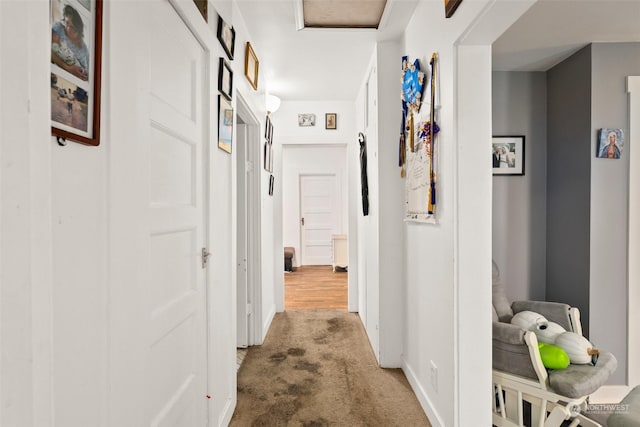 corridor with light colored carpet