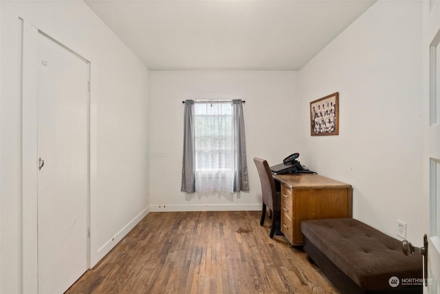 home office with hardwood / wood-style flooring