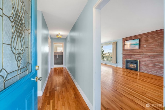 hall with light hardwood / wood-style flooring