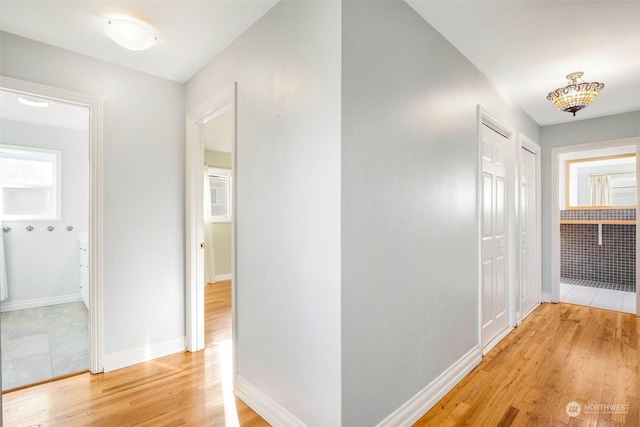 hallway featuring light wood-type flooring