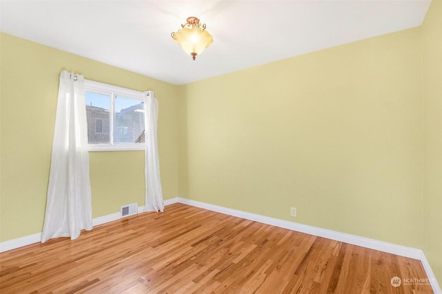 empty room with light wood-type flooring