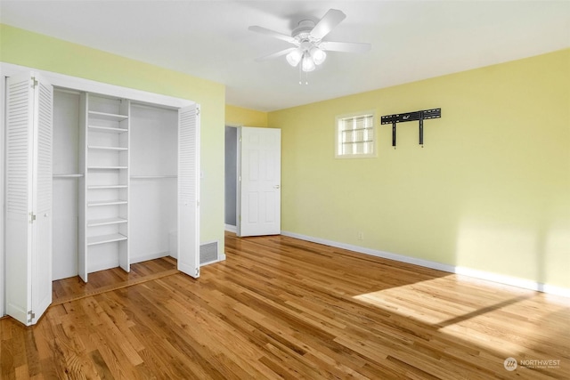 unfurnished bedroom with hardwood / wood-style flooring and ceiling fan