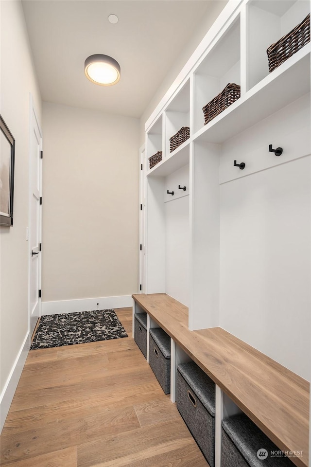 mudroom with light hardwood / wood-style flooring