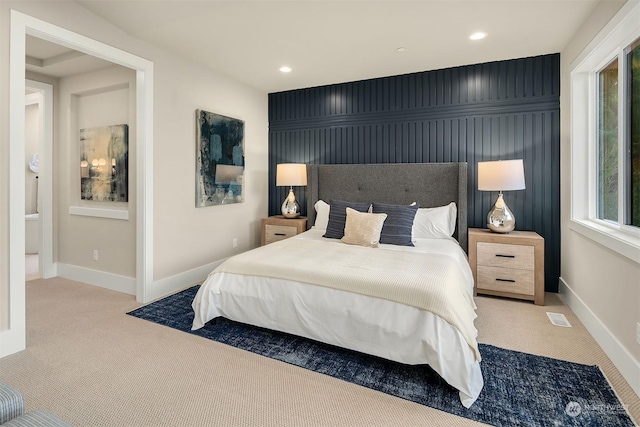 bedroom with light colored carpet