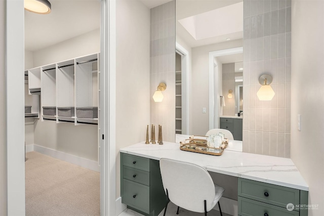 bathroom featuring tile walls and vanity