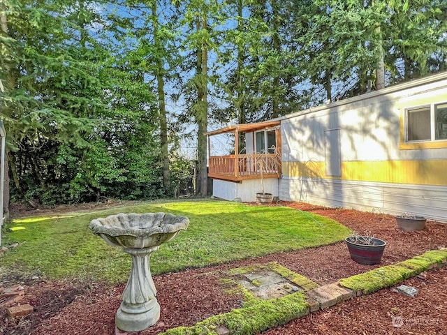 view of yard featuring a deck