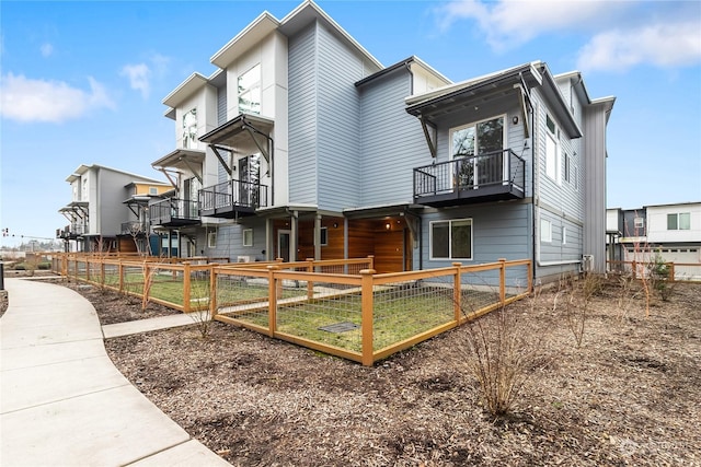 view of side of property featuring a balcony